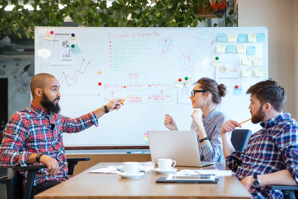 Multiethnic group of business people working together in office-x
